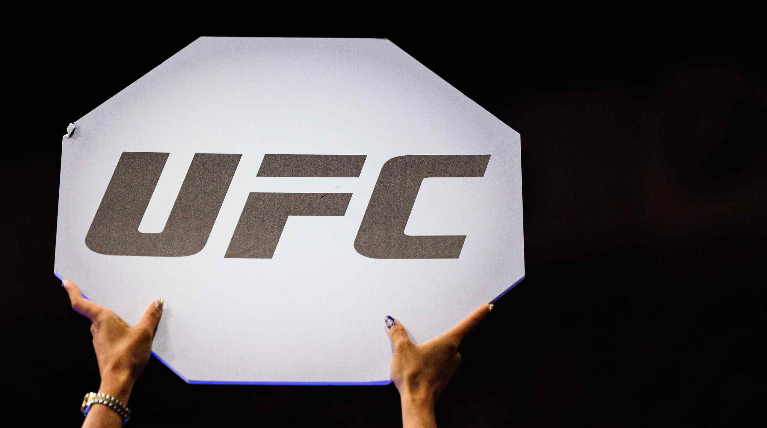 A UFC sign held high.